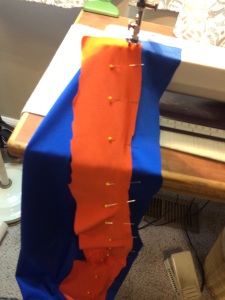 Adding the orange stripe to the bottom of the running skirt (Use lots of pins! ...and then realize the fabric will shift and stretch anyway...)